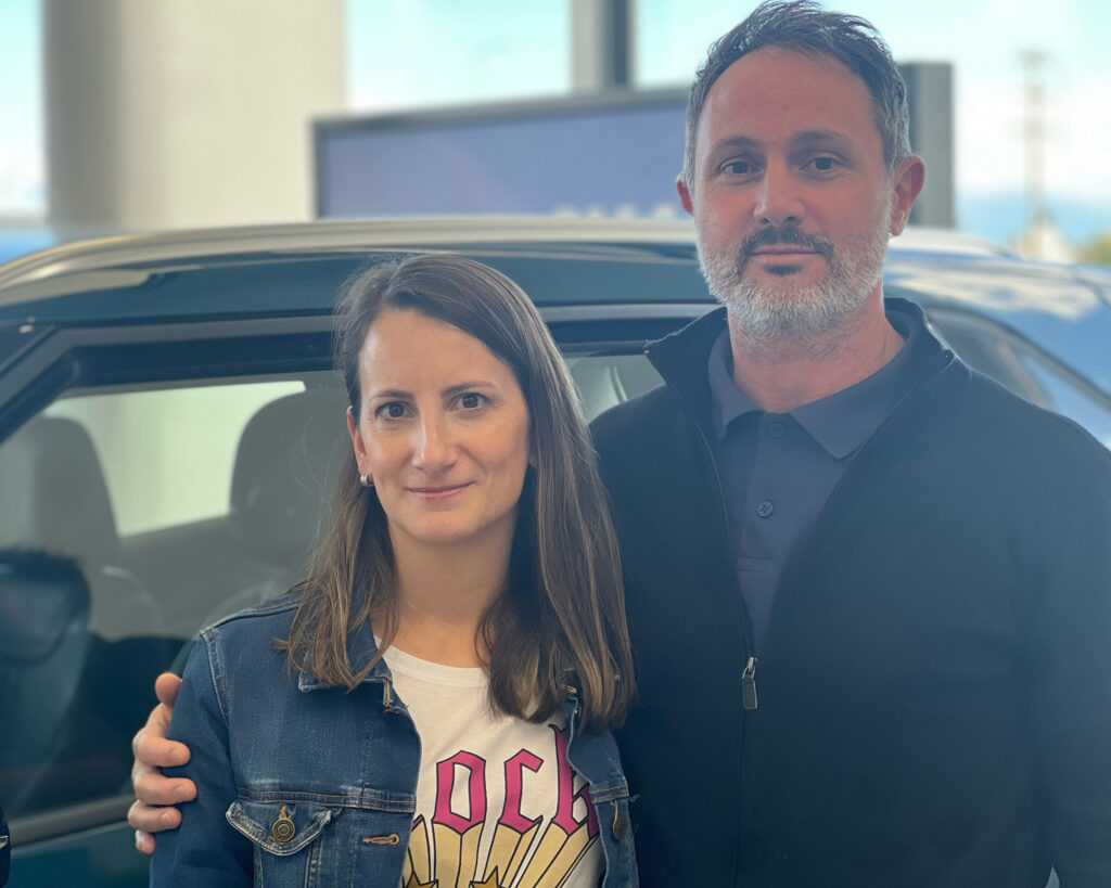 María Victoria Bruzzesi and Franco Martín Silvestre await delivery of their new BYD Yuan Pro on April 24. They first encountered BYD on Instagram and plan to purchase a second hybrid vehicle in the future. Credit: Katie Surma/Inside Climate News