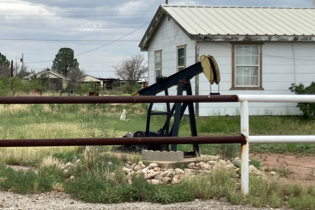 An inactive pumpjack sits in a yard in Imperial, Texas. The small town is surrounded by oilfields. Credit: Martha Pskowski/Inside Climate News