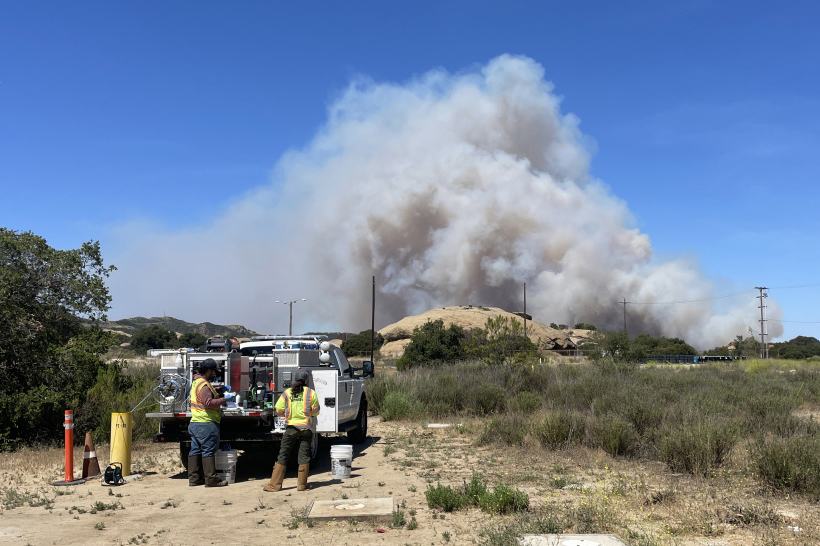 Department of Energy workers monitor the Sandy Fire near the Santa Susana Field Laboratory on May 18. Credit: Josh Mengers/DOE