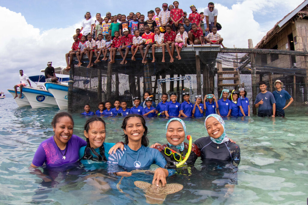 The ReShark team prepares for a release with schoolchildren from Dampier, Indonesia. Credit: Papua Diving Resorts