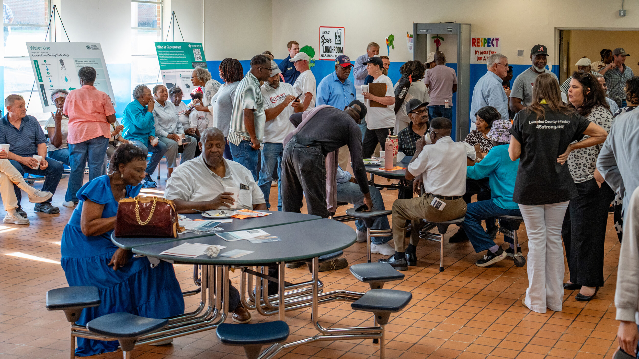 Hayneville residents gather in a middle school now closed due to a declining local population for an open house with developers of a proposed hyperscale data center campus. Credit: Lee Hedgepeth/Inside Climate News