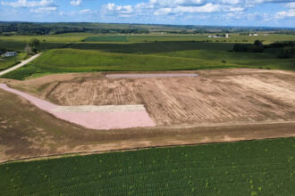 A former soybean field and six-acre earthen basin in Castana, Iowa, where a private developer planned to dump dehydrated manure from an out-of-town slaughterhouse. Credit: Scott Koepsell
