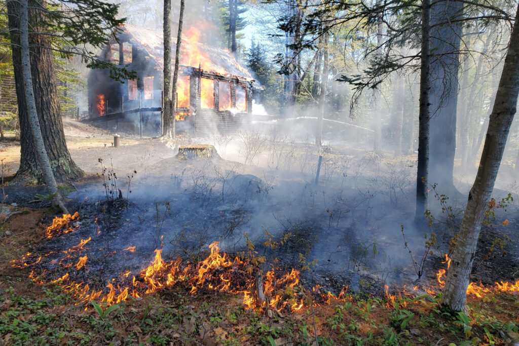 New England’s dense populations amid vast forests mean that even a small, localized wildfire can threaten homes or lives. Credit: Maine Forest Service