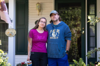 Veronica and Ryan Harper moved into their home in Mt Eyre Manor eight years ago and did not know that the development was situated on top of a petroleum pipeline. Credit: Tracie Van Auken/Inside Climate News