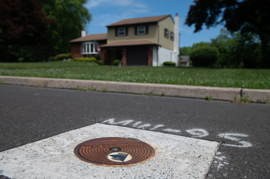 A monitoring well has been installed in front of a home on Spencer Road, which was purchased by Energy Transfer soon after the company discovered the spill. Credit: Tracie Van Auken/Inside Climate News