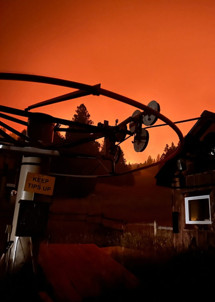 The red glow of the Sand Creek Fire spreads across Maverick Mountain as flames move through the community ski area in southwestern Montana. Credit: Maverick Mountain Resort