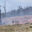 Smoke rises around the burned chairs at Maverick Mountain in Montana after the Sand Creek Fire damaged the ski area. Credit: Maverick Mountain Resort