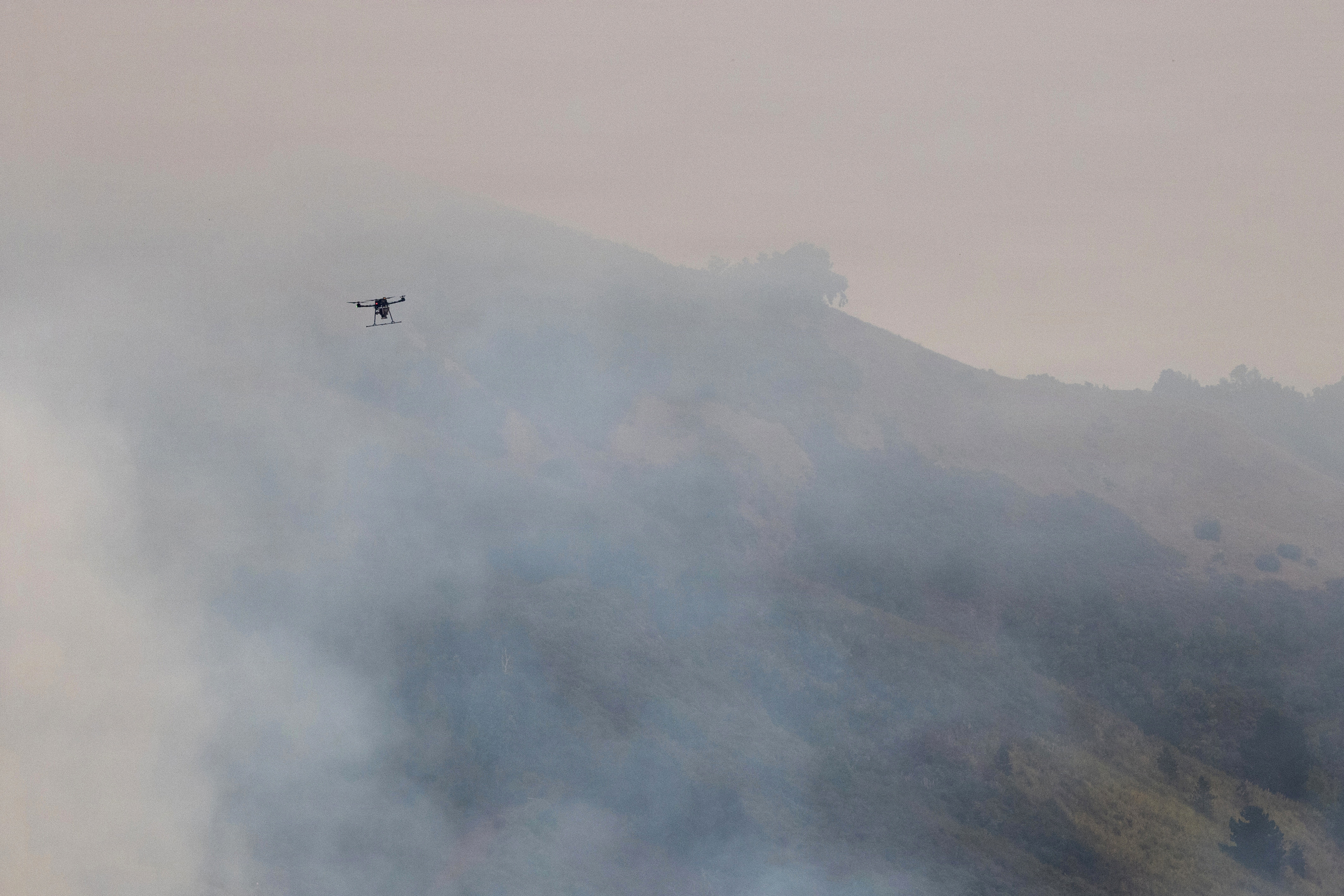 A drone gathers intelligence for wildland firefighters on the ground during the Timber Fire near Big Sur, Calif., on Aug. 17. Credit: Andrew Avitt/U.S. Forest Service