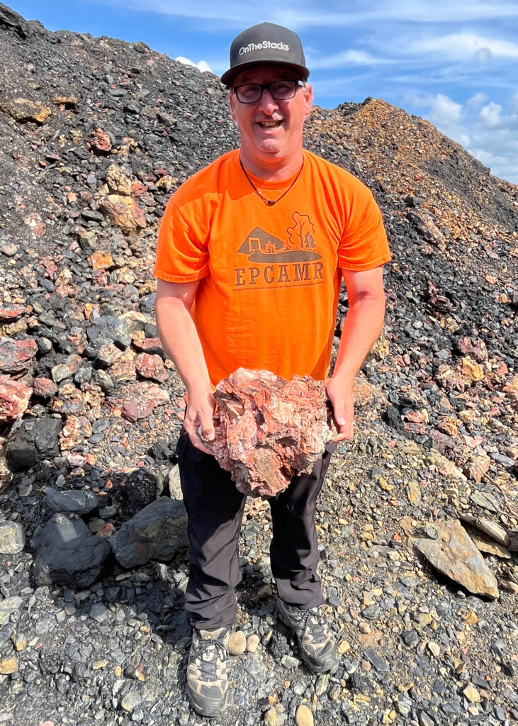 Bobby Hughes, of Eastern Pennsylvania Coalition for Abandoned Mine Reclamation, stands in an Eastern Pennsylvania coal pile. Credit: Jessica Klein/Inside Climate News
