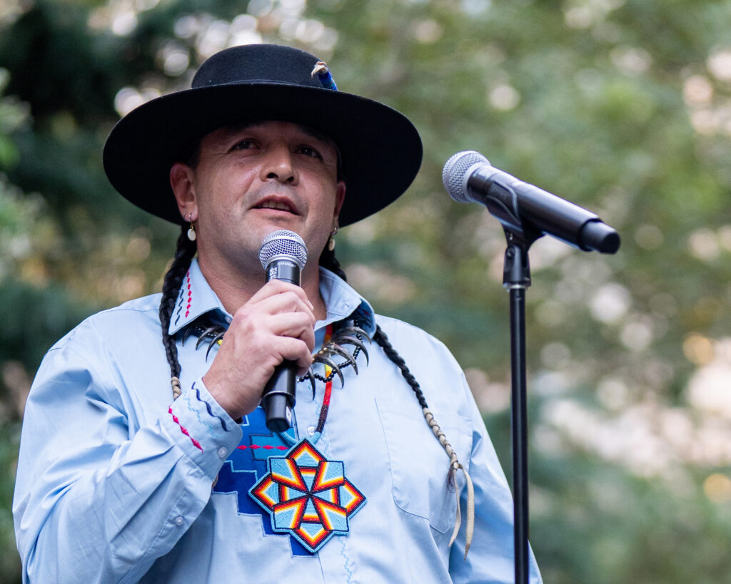 Jason Baldes addresses New Yorkers at City Hall Park during the buffalo march. Credit: Jake Bolster/Inside Climate News