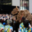 Puppeteers and their buffalo encounter a marching band near City Hall in downtown Manhattan on Saturday. Credit: Jake Bolster/Inside Climate News
