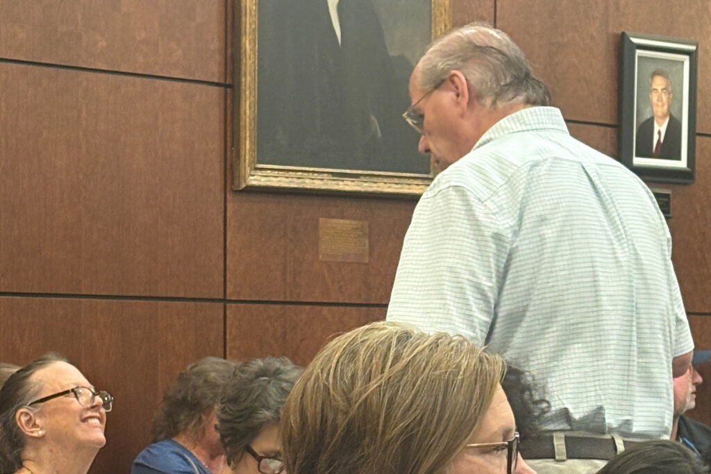 Chris Hopkins (right), who organized opposition to the asphalt plant, attends the Aug. 27 Forsyth County Commissioners meeting. Credit: Lisa Sorg/Inside Climate News