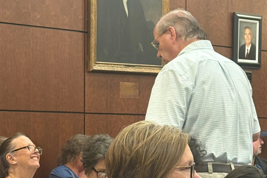 Chris Hopkins (right), who organized opposition to the asphalt plant, attends the Aug. 27 Forsyth County Commissioners meeting. Credit: Lisa Sorg/Inside Climate News