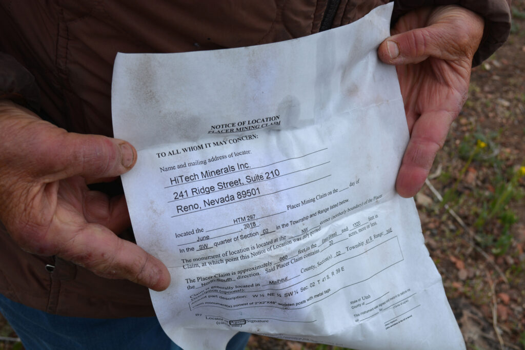 Katie Fite holds the paperwork found within a mining claim from Jindalee’s subsidiary HiTech Minerals in the McDermitt Caldera on May 4, 2025. Credit: Wyatt Myskow/Inside Climate News