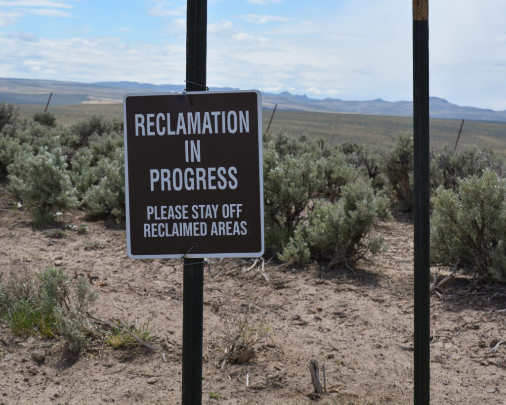 A reclamation sign is seen near a former drilling site of Jindalee’s claims area on May 4, 2025. Credit: Wyatt Myskow/Inside Climate News
