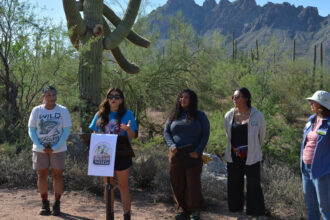 Cassandra Becerra, the Arizona State Director for Mountain Mamas, speaks at a press conference on Saturday kickstarting Latino Conservation Week and highlighting the threats facing Ironwood Forest National Monument. Credit: Wyatt Myskow/Inside Climate News