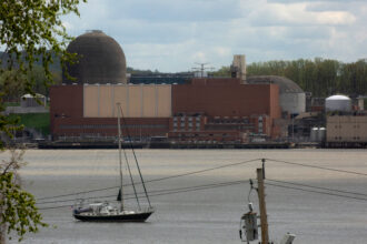 A boat sails on the Hudson River in front of the Indian Point nuclear power plant on April 30, 2021. Credit: Kena Betancur/Getty Images