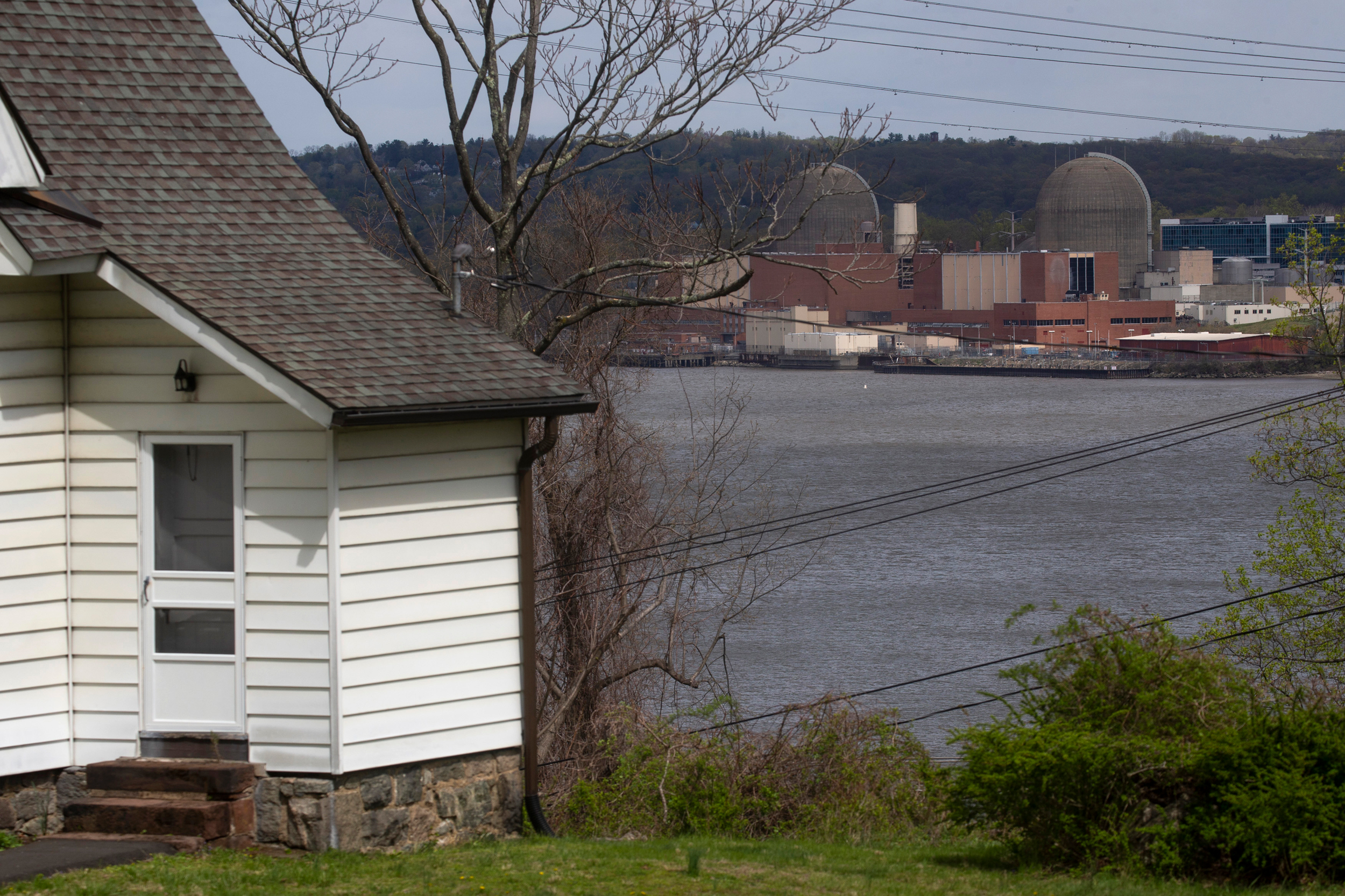 The shuttered Indian Point nuclear power plant is seen from a neighborhood in Tomkins Cove, N.Y. Credit: Kena Betancur/VIEWpress via Getty Images