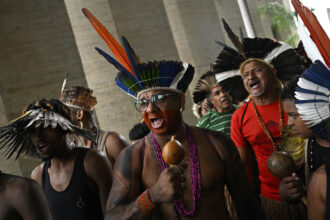 Pataxo and Tupinamba Indigenous people demand justice for the murder of Vitor Braz during a protest in front of the Ministry of Justice in Brasília, Brazil, on March 12, 2025. Credit: Mateus Bonomi/Anadolu via Getty Images