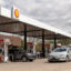 People fill their cars with gas at a Shell station in Birmingham, Mich. Credit: Adam J. Dewey/Anadolu via Getty Images