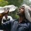 A worker cools off with water during high temperatures in Amritsar, India, on June 29. Credit: Narinder Nanu/AFP via Getty Images