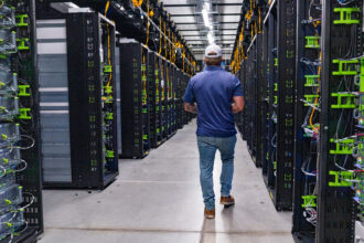 A Meta worker leads a tour of the company’s data center in Temple, Texas, on July 22. Credit: Mikala Compton/The Austin American-Statesman via Getty Images