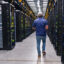 A Meta worker leads a tour of the company’s data center in Temple, Texas, on July 22. Credit: Mikala Compton/The Austin American-Statesman via Getty Images