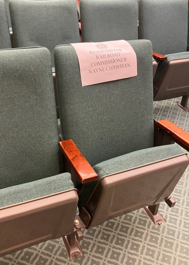 A seat reserved for Railroad Commissioner Wayne Christian sits empty at the Texas House Committee on Energy Resources Tuesday meeting. Credit: Martha Pskowski/Inside Climate News