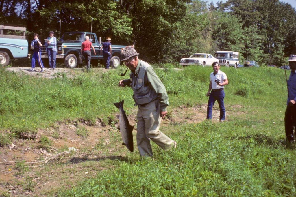 Men with Narraguagus salmon caught off Cable Pool Park in Cherryfield in the 1980s, before the recreational fishery closed and Atlantic salmon were listed as endangered. Credit: Jim Blakeslee, courtesy of the Downeast Salmon Federation