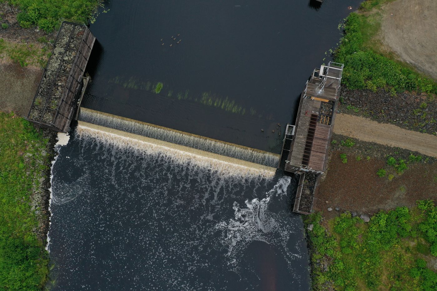 An aerial view of the former Cherryfield ice-control dam on the Narraguagus River, which has just been demolished. Credit: Courtesy of Inter-Fluve and the Downeast Salmon Federation