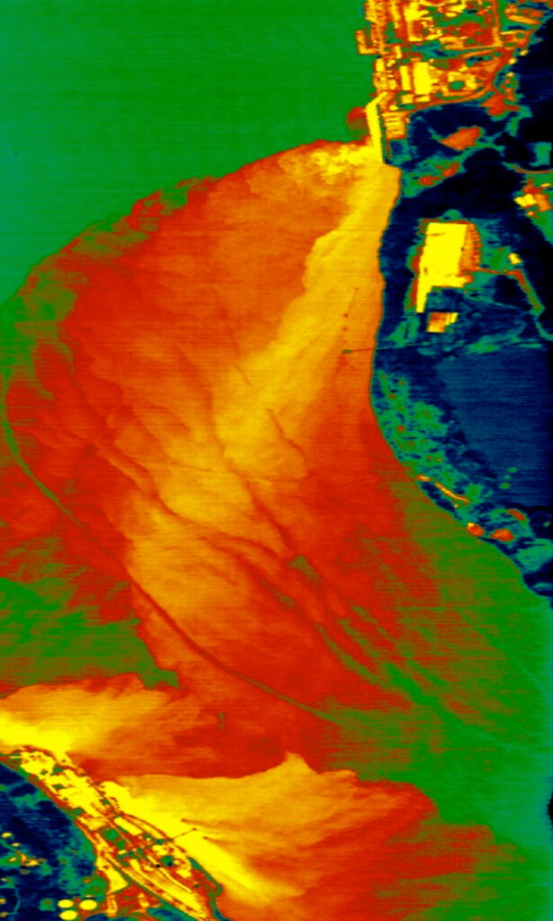 A 1998 infrared image taken by scientists from GER/SpectroTech, Inc. shows the thermal plume from Indian Point and Lovett power plants. Red indicates discharge temperatures from 1-8 degrees hotter than ambient river water, and yellow indicates up to 14.5 degrees hotter.