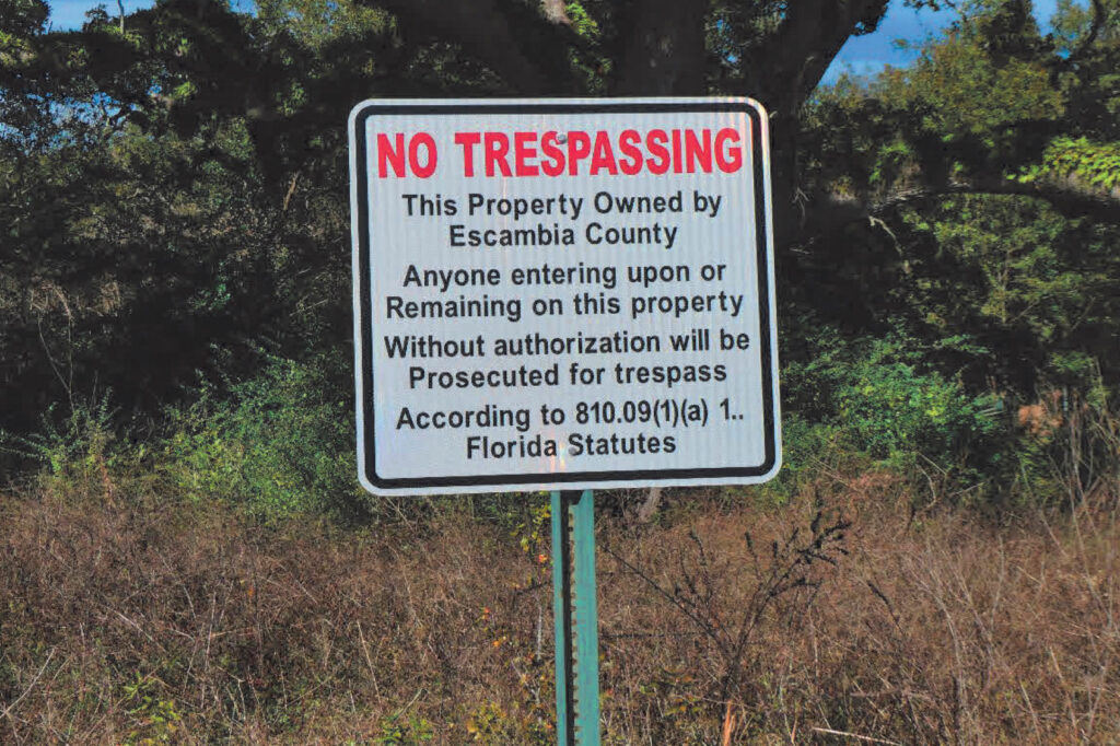 A no trespassing sign stands in a neighborhood near the Superfund site. Credit: EPA