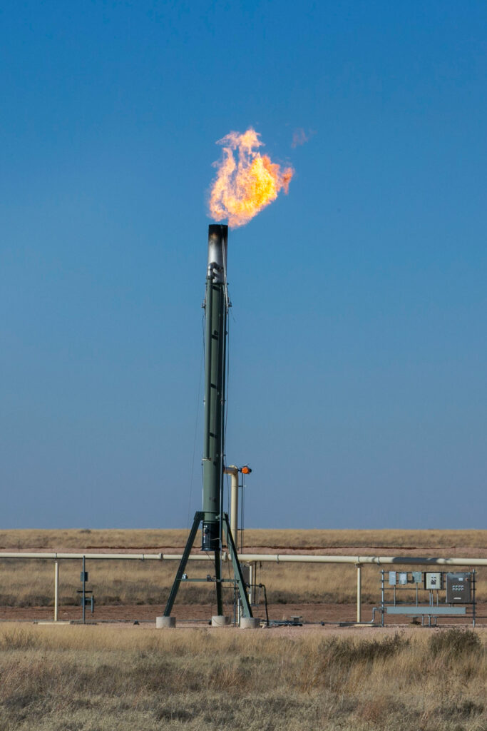 A flare burns methane gas in the Permian Basin. Burning methane produces carbon dioxide, a less potent greenhouse gas. Credit: Dylan Baddour/Inside Climate News