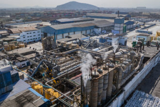 Smoke rises from a fishmeal factory in 2025 near a residential community in Callao, Peru. Credit: Ministry of Production of Peru