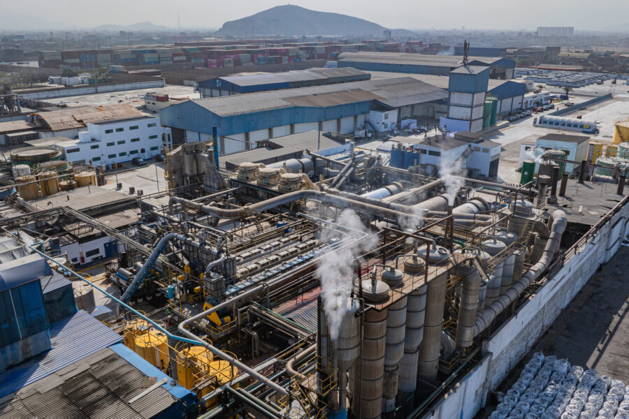Smoke rises from a fishmeal factory in 2025 near a residential community in Callao, Peru. Credit: Ministry of Production of Peru