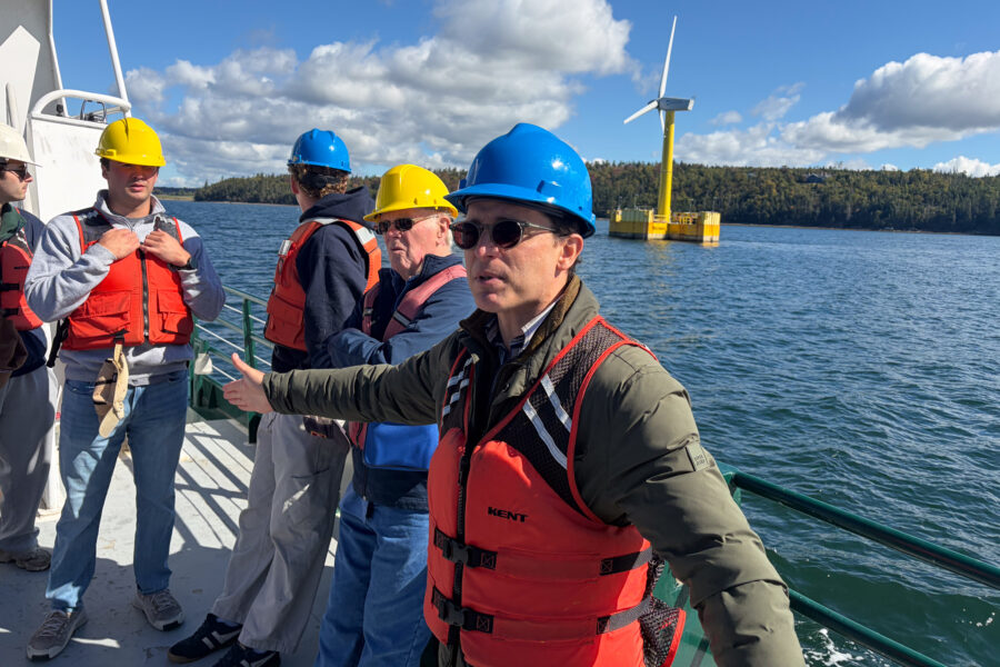 Anthony Viselli, chief engineer at the Advanced Structures and Composites Center at the University of Maine, explains the workings of a floating turbine. Credit: Nathaniel Eisen/Inside Climate News