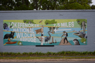 A sign in the town of Folkston advertises the Okefenokee National Wildlife Refuge. Credit: Ryan Krugman/Inside Climate News