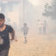 People evacuate after a wildfire swept through the village of Voden amid a heat wave in Bulgaria on July 17, 2024. Credit: Ivan Yanev/Bgnes News Agency/AFP via Getty Images