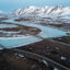 An aerial view of the Dalton Highway and a portion of the Trans-Alaska Pipeline System crossing over the frozen Atigun River in North Slope Borough, Alaska. Credit: Lance King/Getty Images