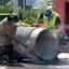 Crews prepare a replacement pipe as they repair a water main in West Hollywood, Calif., on July 17. Credit: Myung J. Chun/Los Angeles Times via Getty Images
