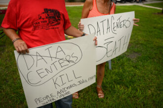 Protesters demonstrate against AI data center development on July 18 in New Port Richey, Fla. Credit: Thomas Simonetti/AFP via Getty Images