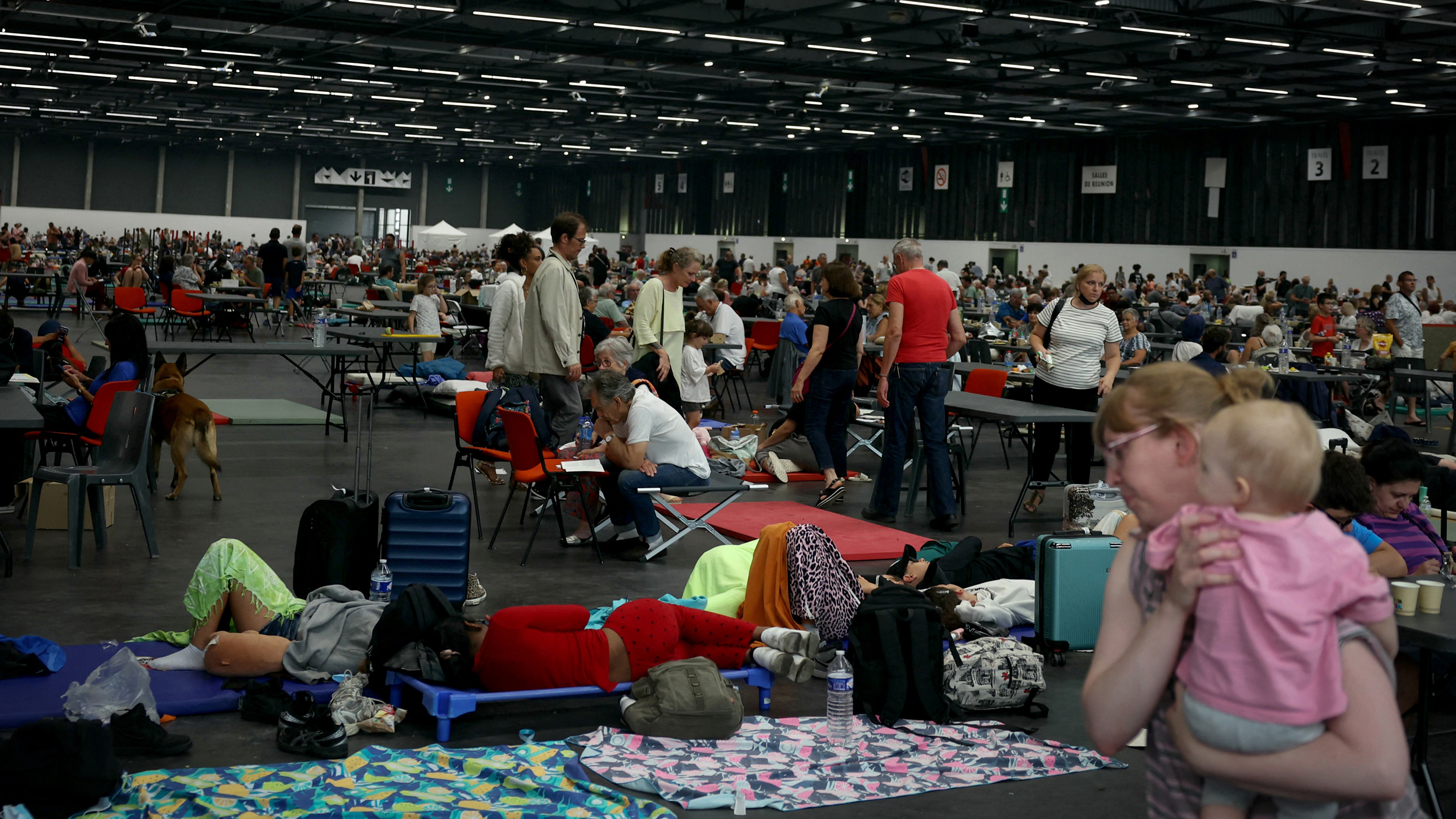 People evacuated due to wildfires shelter at the Parc des Expositions on July 25 in Bordeaux, France. Credit: Alain Jocard/AFP via Getty Images