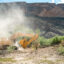 An excavator plows through land during construction for a section of the border wall on Aug. 14 in Big Bend National Park. Credit: Brandon Bell/Getty Images