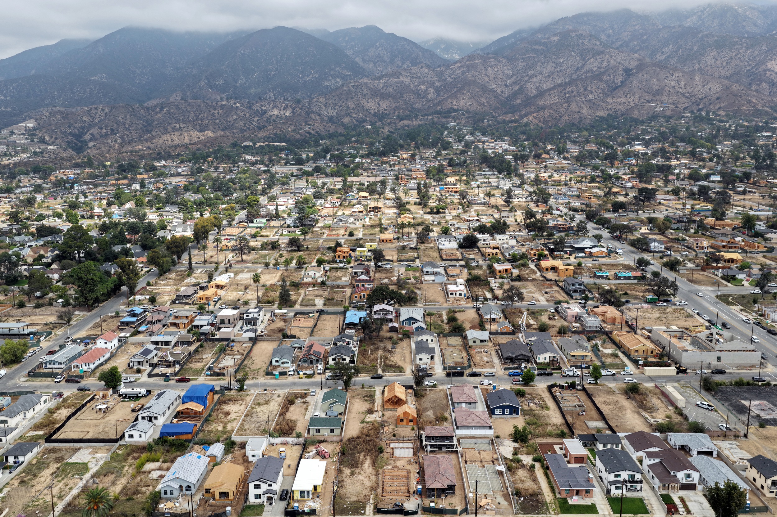 An aerial view of homes being rebuilt amid cleared lots on Sept. 17 in Altadena, Calif. Credit: Mario Tama/Getty Images