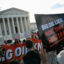 People protest in front of the Supreme Court during arguments in the Suncor v. Boulder case on Monday in Washington, D.C. Credit: Jim Watson/AFP via Getty Images