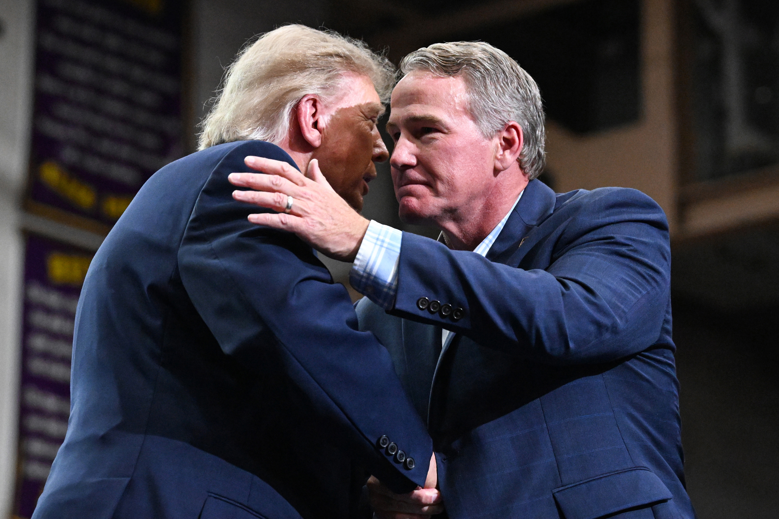 President Donald Trump shakes hands with U.S. Sen. Jon Husted during a campaign rally on Oct. 3 in Vandalia, Ohio. Credit: Roberto Schmidt/Getty Images