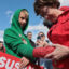 U.S. Sen. Susan Collins signs the cast of Finley Swartz at a Maine fairgrounds. Swartz is holding a Susan Collins sign.
