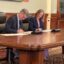 Gov. Mark Gordon and Federal Permitting Improvement Steering Council Executive Director Emily Domenech sign a memorandum of understanding on Oct. 26, 2026 "to prevent unnecessarily long reviews for critical infrastructure projects."