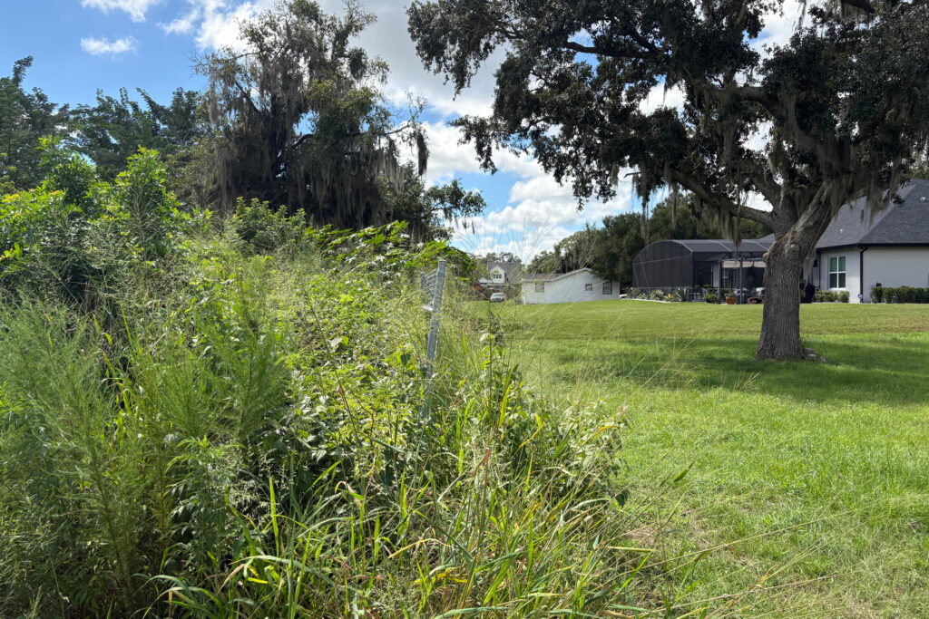 The landfill site is within a few dozen feet of some of the homes in Whitted. Credit: Amy Green/Inside Climate News