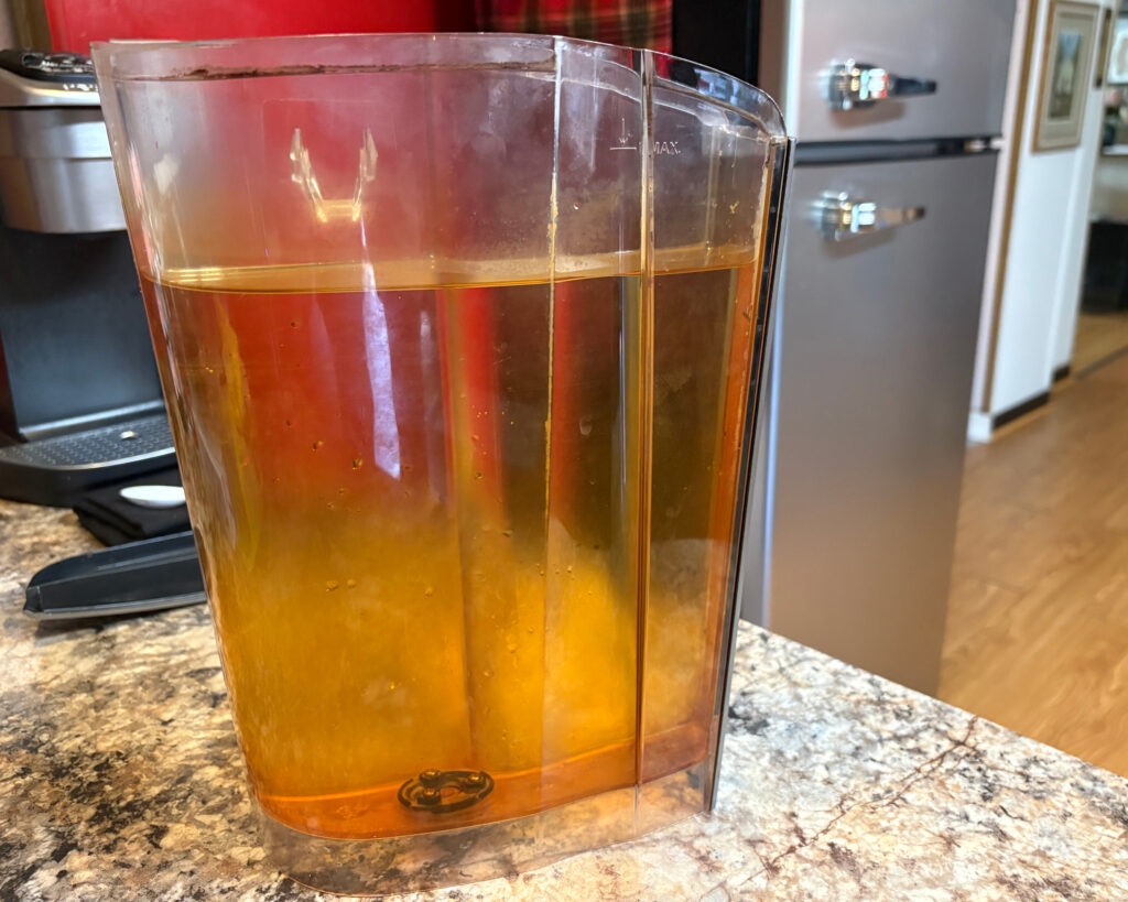 When the water runs brown in Ann Jones’ home, it can look like iced tea. She estimates she and her husband spend about $150 a month on bottled water. Credit: Amy Green/Inside Climate News